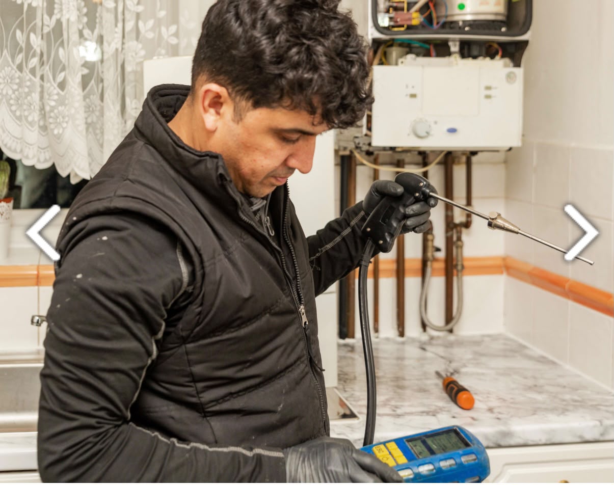 TK Home Services Ltd engineer carrying out boiler flue gas analysis