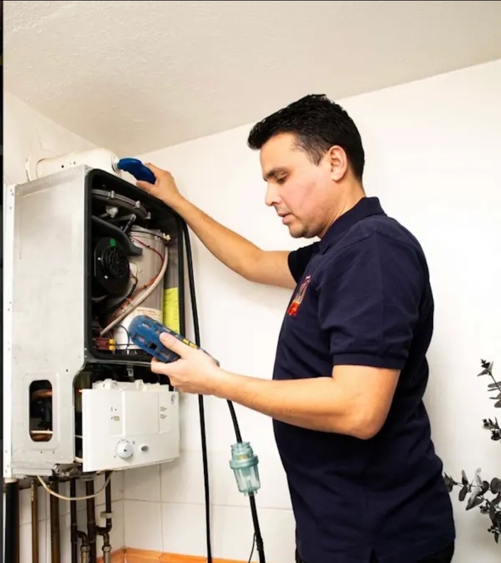 TK Home Services Ltd engineer servicing a boiler
